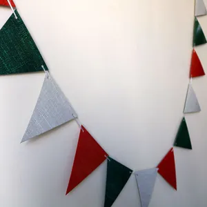 Detail showing the linen texture and stitching of red and green triangular party banners