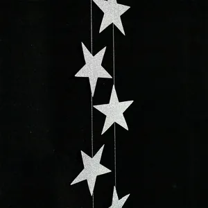 Macro view of 7cm silver glitter star garland for festive wedding and party decorations