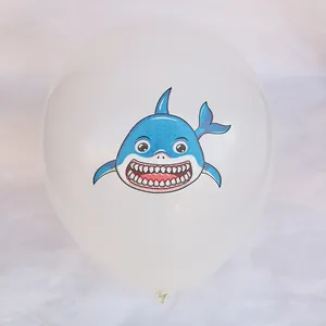Detail view of 12-inch latex balloon with printed blue shark for birthday ocean party
