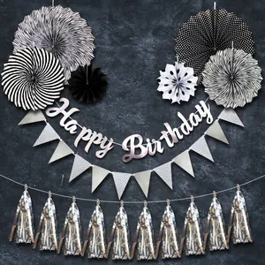 Detail of silver foil paper fan decor set with Happy Birthday banner and metallic tassels
