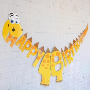 Detail view of yellow dinosaur happy birthday banner with cartoon paper spikes