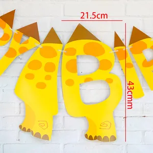 Detail of yellow giraffe birthday banner with 21.5x43cm dimensions on white wall