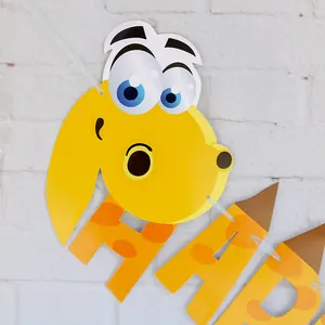 Detail of yellow giraffe and paper letters on a festive Happy Birthday banner