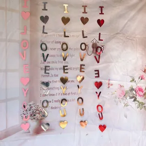 Vertical I LOVE YOU heart banners in pink, gold, and red for Valentine's party decor