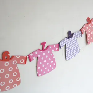 Detailed close-up of 6 to 9 months baby first birthday photo banner with dot and grid patterns