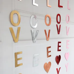 Vertical hanging I LOVE YOU heart banners in metallic gold, silver, and rose gold finishes