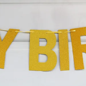 Golden glitter Happy Birthday paper banner for party decoration and festive event setup