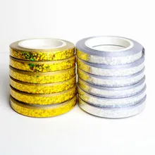 Detalle de 12 rollos de cintas holográficas con purpurina oro y plata para arte de uñas