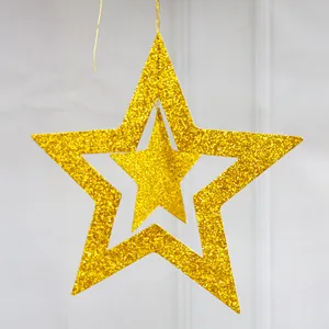 Detailed view of double-layered gold glitter star hanging decoration for holiday party
