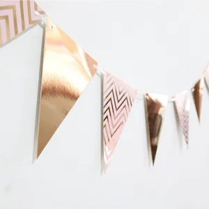 Rose gold bunting banner with metallic foil and chevron patterns for party decorations