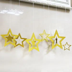Golden glitter hanging paper star garland decorations for Christmas and New Year holiday parties