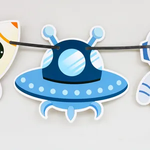 Detailed close-up of a blue cartoon UFO paper banner for children's space theme parties