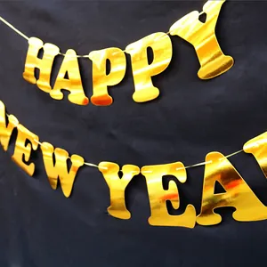 Shiny gold metallic Happy New Year banner letters for New Year party decoration