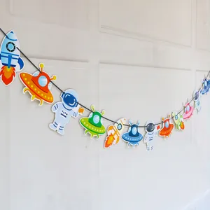 Vibrant space themed paper banner with astronaut and rocket designs for kids birthday parties