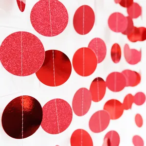 Detail of red glitter and mirror finish circle garland for festive party decorations