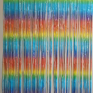 Detailed close-up of rainbow gradient foil fringe curtain with metallic shiny texture