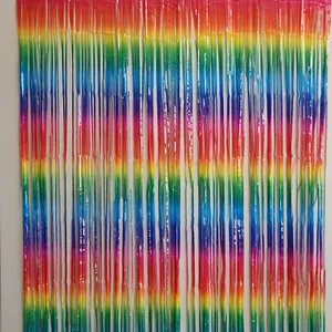 Macro shot of colorful rainbow foil fringe curtain for festive party backdrop decoration