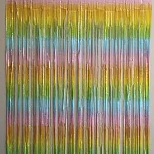 Close-up of rainbow gradient foil fringe curtain with metallic shine for party backgrounds