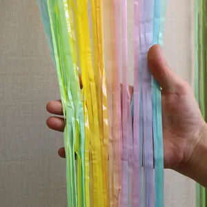 Macro shot of macaron gradient foil fringe curtain showing smooth texture and soft pastel colors