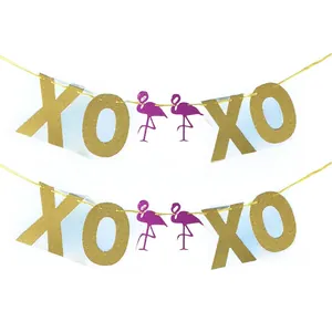 Glittery gold XOXO letters and purple flamingo banner for wedding and party decoration