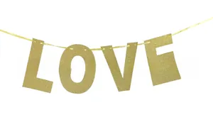 Close-up of golden glitter LOVE letter banner decoration for wedding and party backdrops