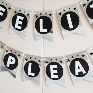 Detail of silver metallic fishtail banner with Feliz Cumpleanos Spanish birthday letters