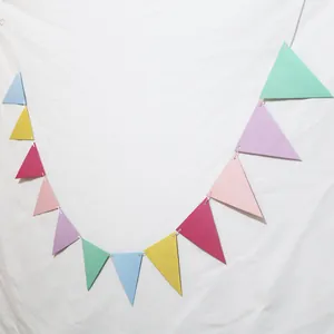 Colorful triangular bunting flags with white string for birthday and party decorations