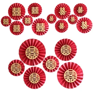 Traditional red and gold wedding paper fans with Xi characters and pearl centers