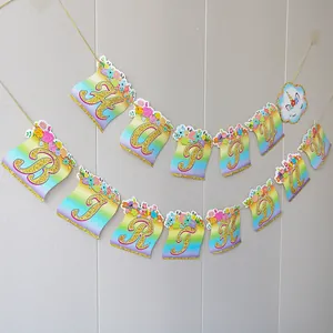 Rainbow unicorn Happy Birthday banner with golden glitter letters and floral accents
