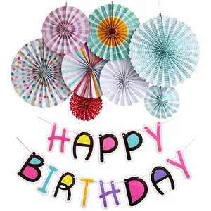 Detail of colorful Happy Birthday banner and eight decorative paper fans set