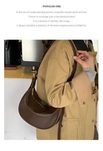 Detail of dark brown lychee leather hobo bag with gold zipper and smooth curved design