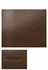 Macro detail of the premium dark brown lychee pattern leather and embossed fashion logo