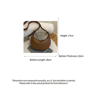 Brown lychee leather half-moon bag with gold hardware and size dimensions 28x17x10cm