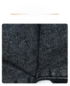 Macro shot showing the durable twill denim fabric texture and sturdy weave of the shoulder bag