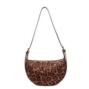 Retro leopard print suede crescent shoulder bag with brown leather strap and metal hardware