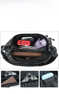 Detail view of large capacity vintage denim bag showing interior space for daily items