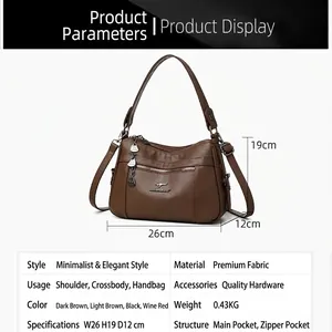 Brown litchi grain leather tote bag with kangaroo logo and adjustable shoulder strap