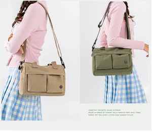 Detail view of khaki and olive green nylon messenger bags with multi-pocket design