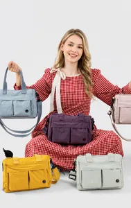 Multi-pocket nylon crossbody bag shown in various vibrant colors for women's daily commute