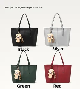 Detailed grid view of large tote bags in black, silver, green, and red with bear charms