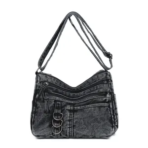 Retro washed black denim crossbody bag with multiple zip pockets and adjustable strap
