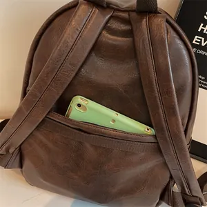 Sac à dos vintage en cuir PU marron avec poche antivol sécurisée pour ranger un smartphone