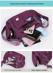 Close-up of dark purple waterproof nylon crossbody bag with quilted diamond pattern