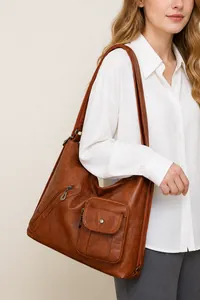 Brown vintage multi-pocket shoulder bag detail shown on model for daily commuting