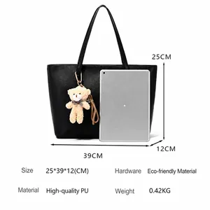 Large black PU leather tote bag for women with a cute beige bear charm and dimensions