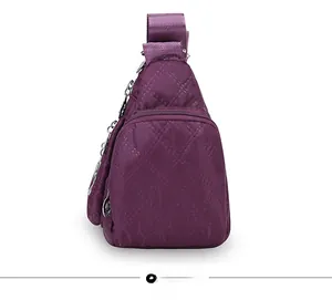 Side view of purple quilted oxford fabric crossbody bag with multi-layer zippers