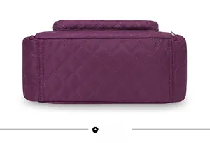 Flat bottom view of purple quilted oxford crossbody bag showing waterproof nylon texture