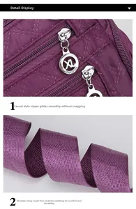 Detail of purple Oxford cloth bag featuring a durable metal zipper and wide woven strap