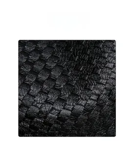 Close-up of the woven black PU leather texture with intricate cross-stitch detailing