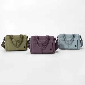 Lightweight nylon tote bag with multiple pockets in olive, purple, and blue colors